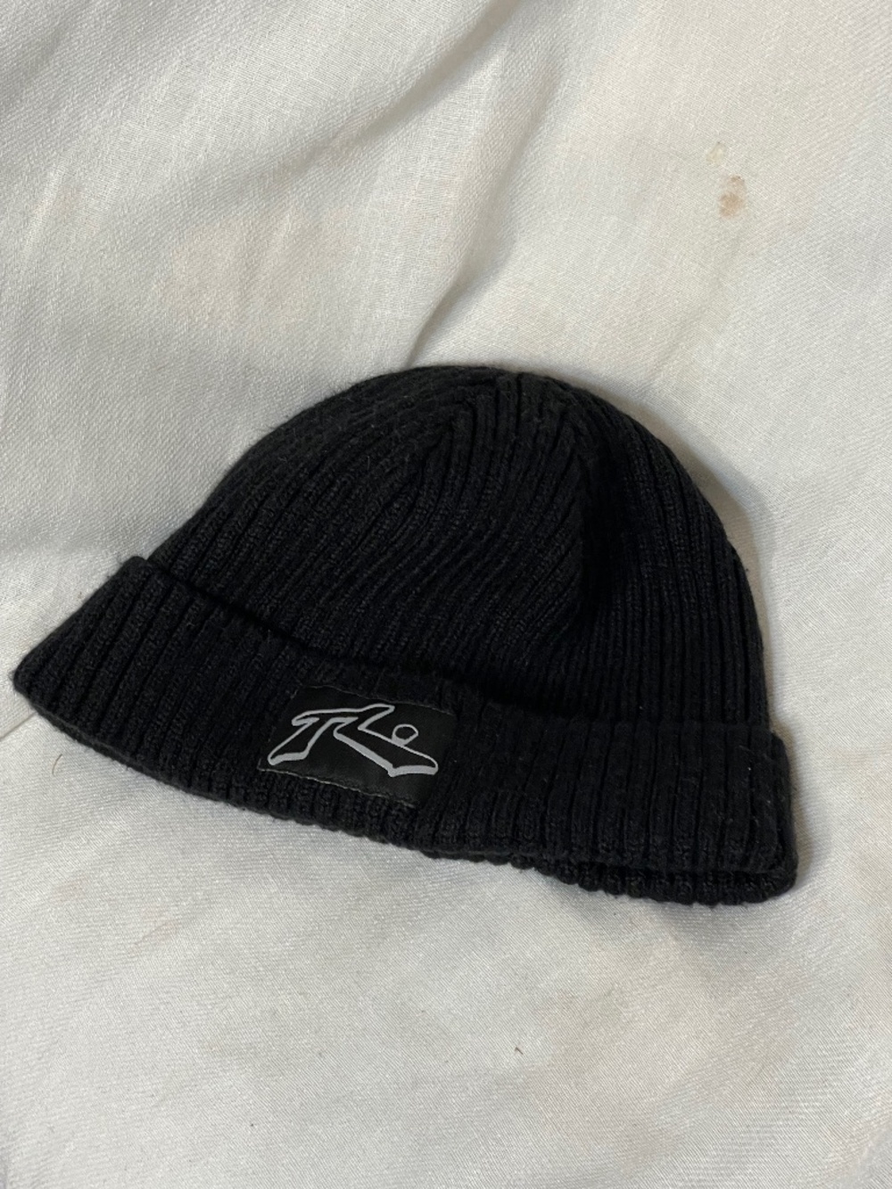 Rusty Black Ribbed Knit Beanie with Logo Patch